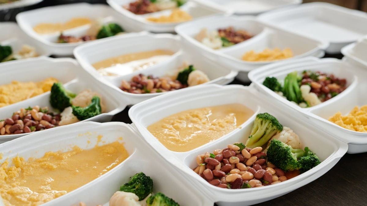 Delicious and nutritious meal prep featuring broccoli, beans, and eggs in containers.